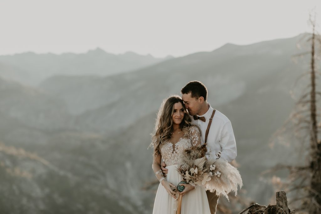 Bride and groom at Glacier Point, Yosemite. Be fearless in pursuit of your dreams
