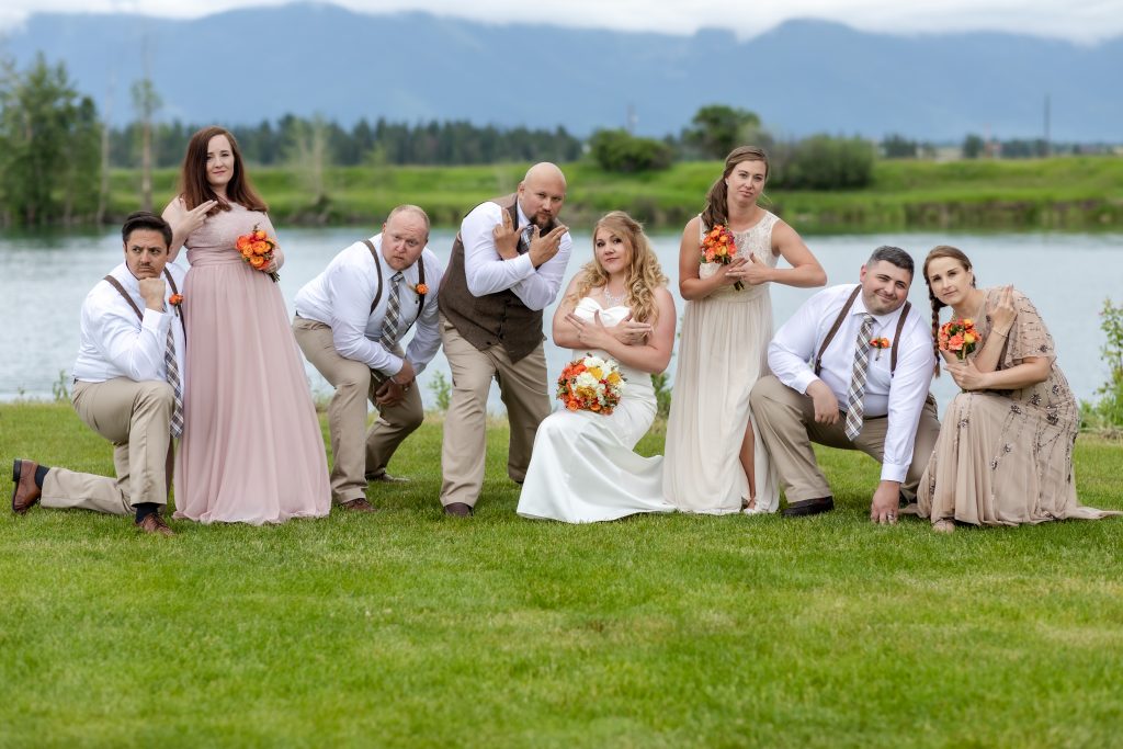 Bridal party in fun pose at Diamond B Weddings in Kalispell, Montana.  